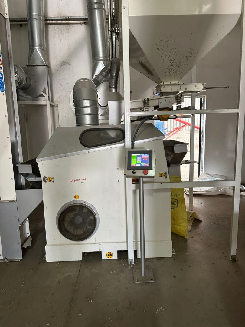 Pressure-type destoner in a full seed processing line